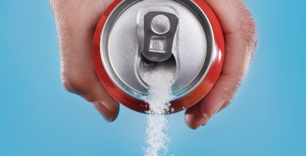 Soda can pouring out sugar