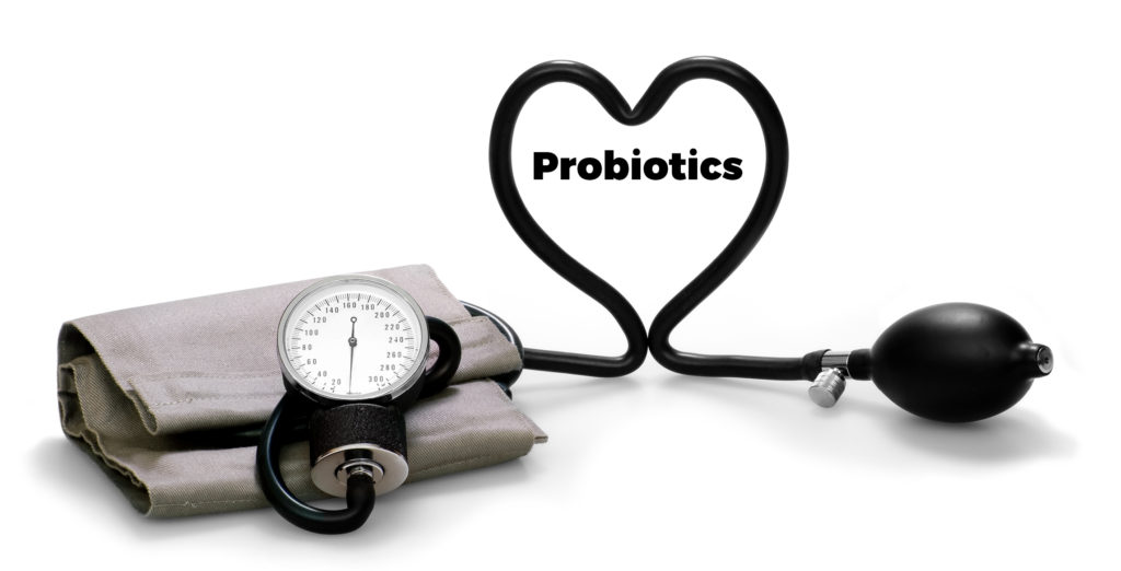 Blood pressure cuff making a heart around "probiotics"