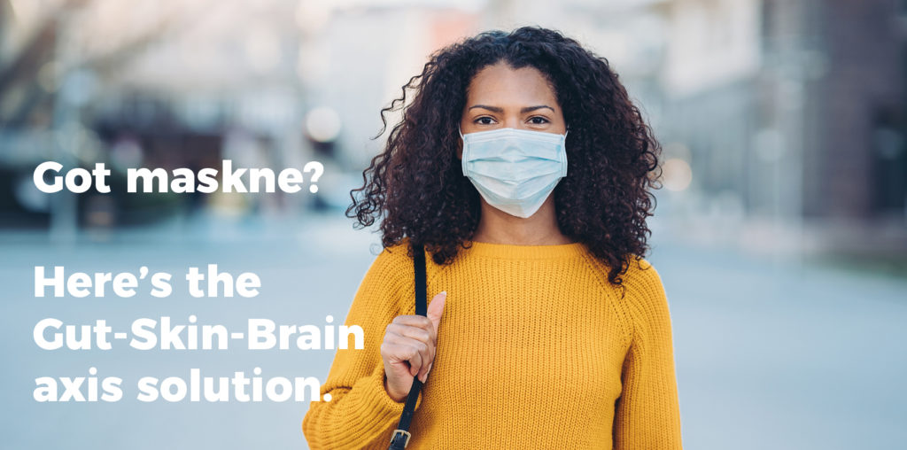 Woman wearing mask with text on photo "Got maskne? Here's the Gut-Skin-Brain axis solution"
