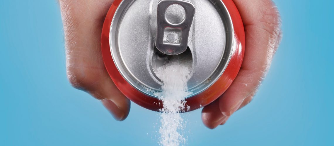 Soda can pouring out sugar
